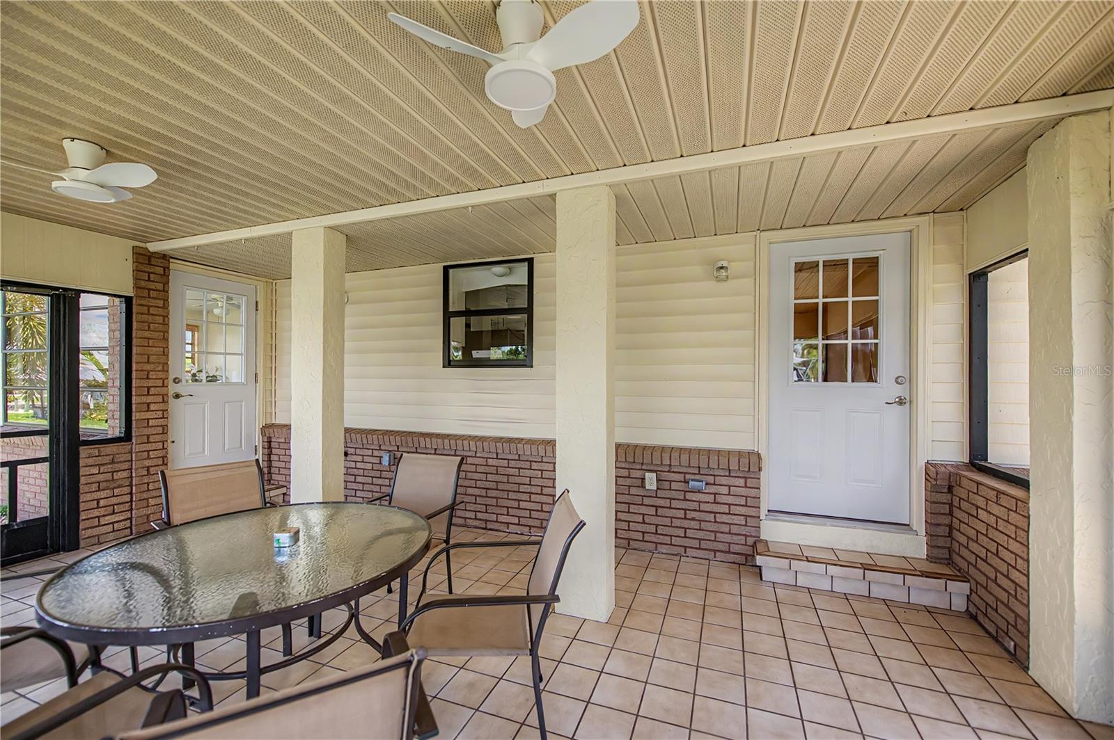 Lanai is Perfect for Outdoor Dining. Keep Cool with Dual Ceiling Fans.