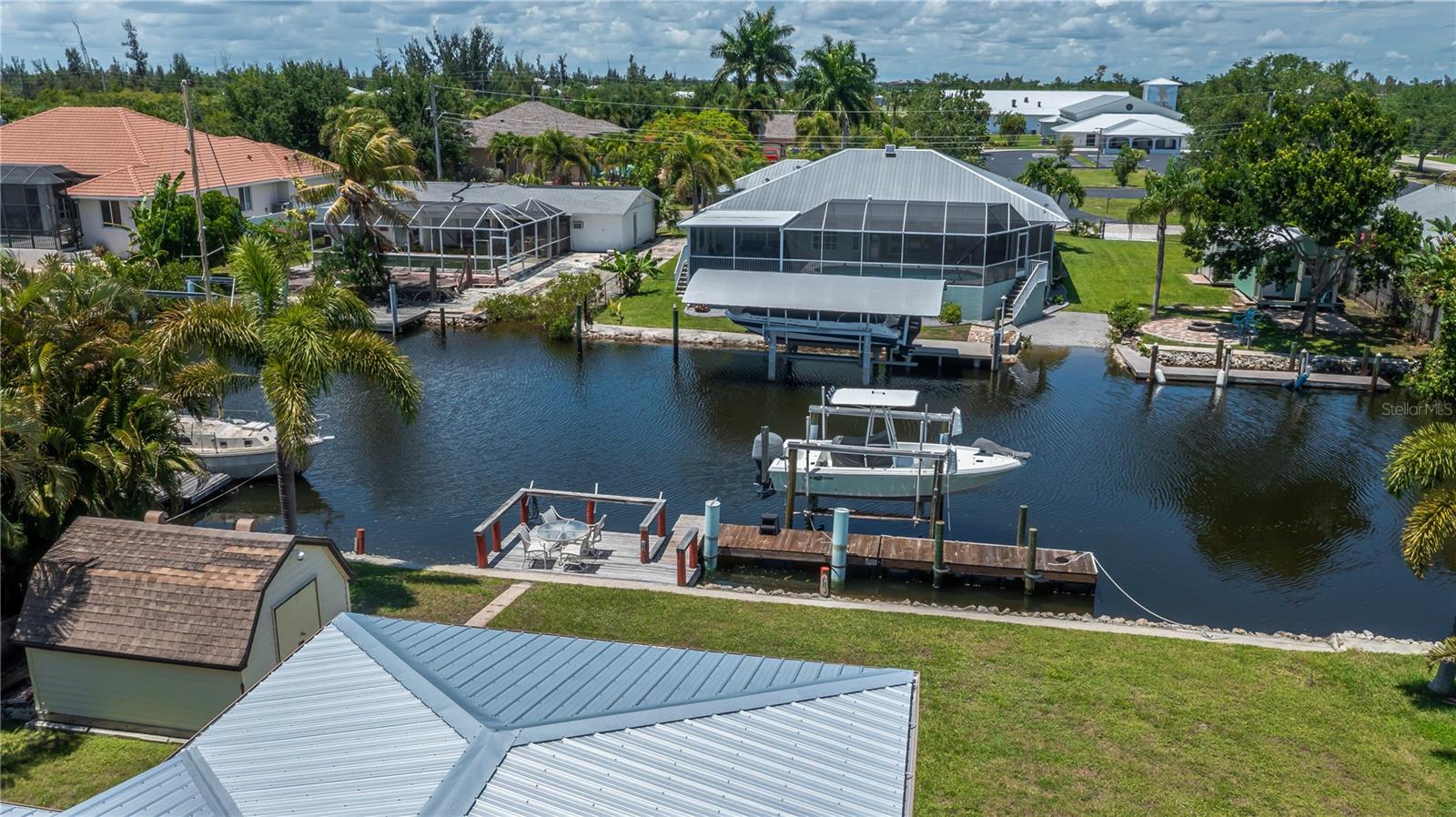 Private Dock and Boat Lift on Sailboat Access Canal.