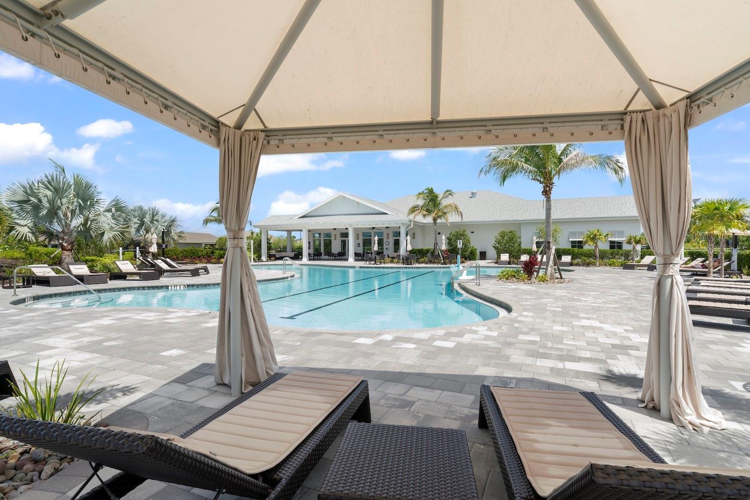 Cabanas lining the resort style pool.