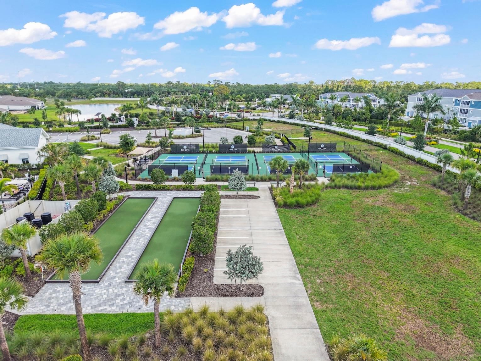 Arial view of bocce courts and pickleball courts.