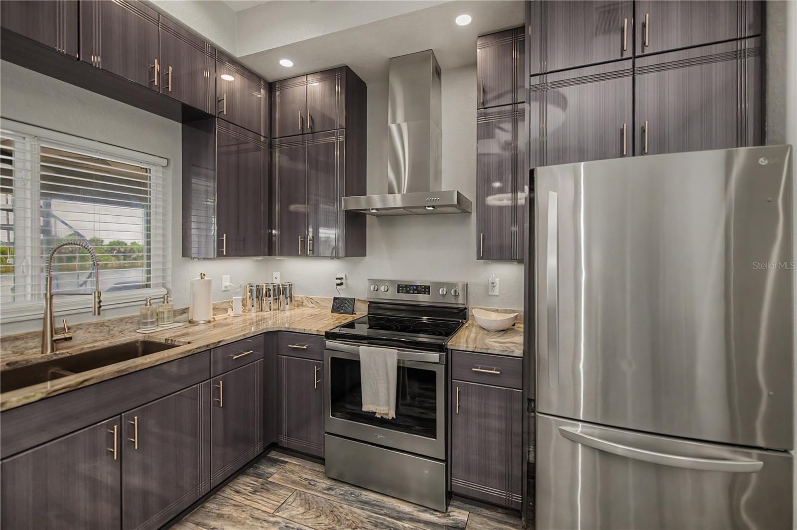 Stainless Steel Appliances, Elegant Stone Countertops.