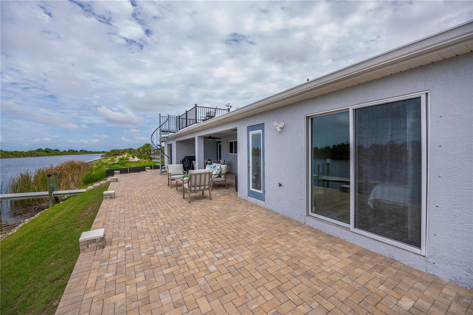 Guest Direct Access to Patio and Waterfront Breezes.