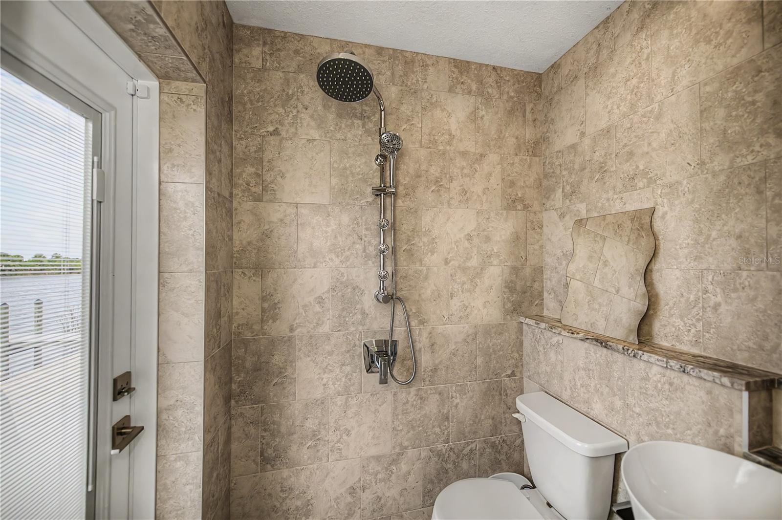Patio Bathroom Featuring a Vessel Sink, Elegant Telework, and Contemporary Fixtures.