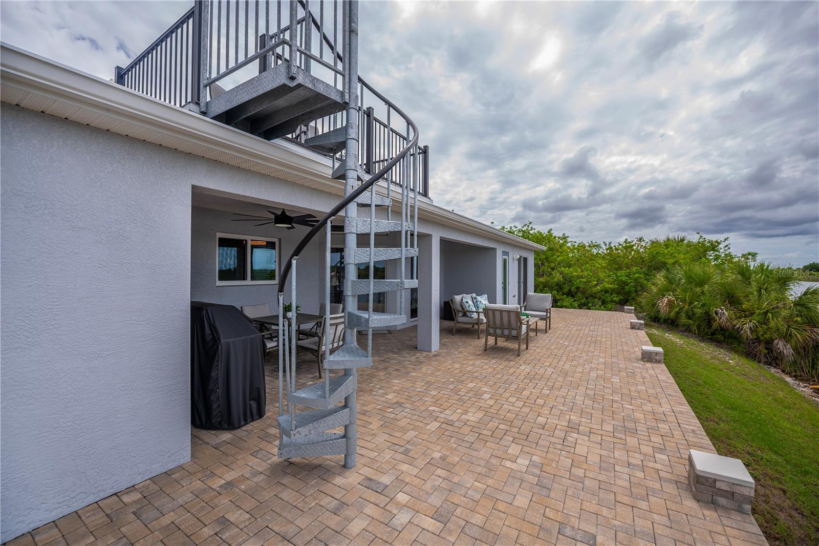 Spiral Staircase Leads to the Rooftop Crow's Nest, Offering Elevated Views.