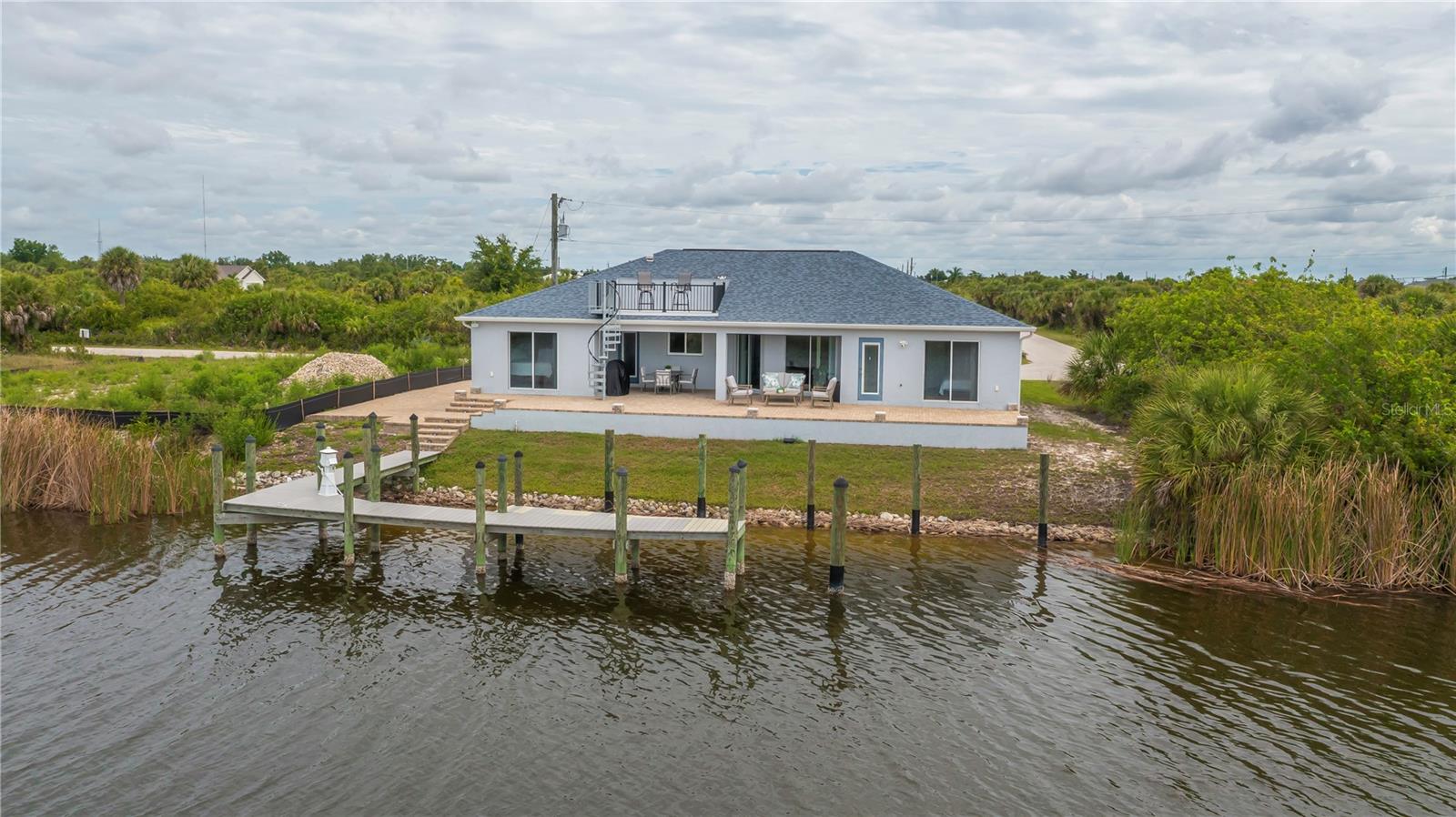 Prime Sailboat-Access Waterfront Living with a Private Dock and Expansive Canal Views.