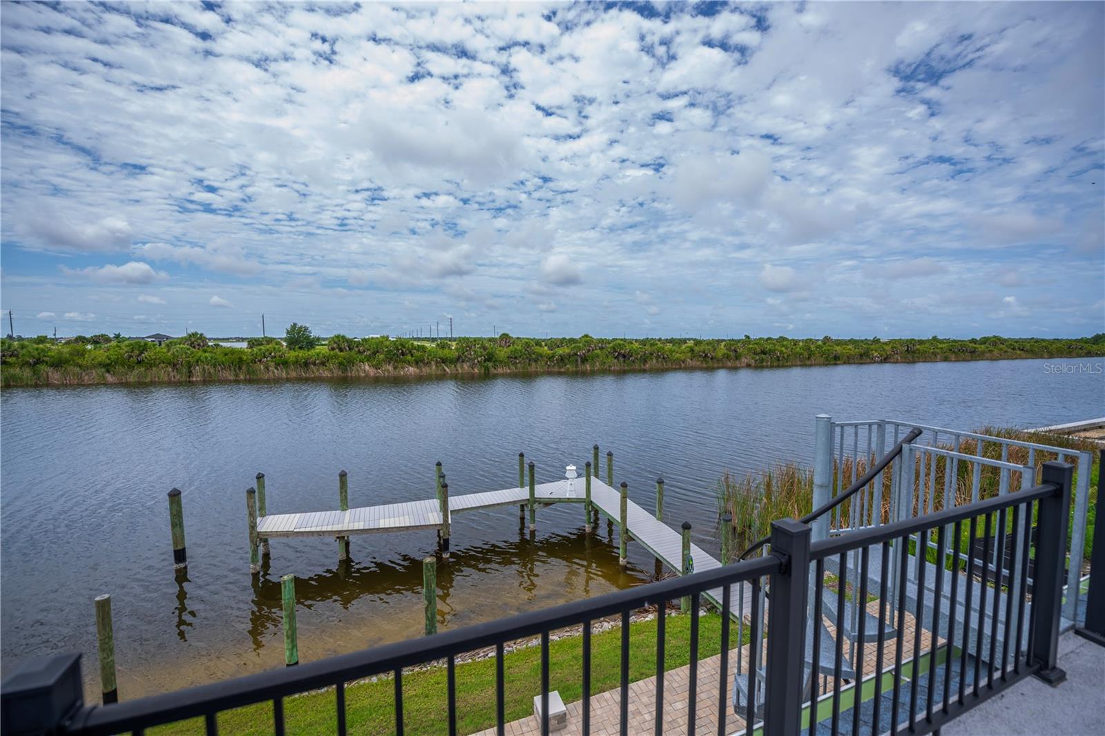 Elevated Balcony Views Overlooking the Private Dock.