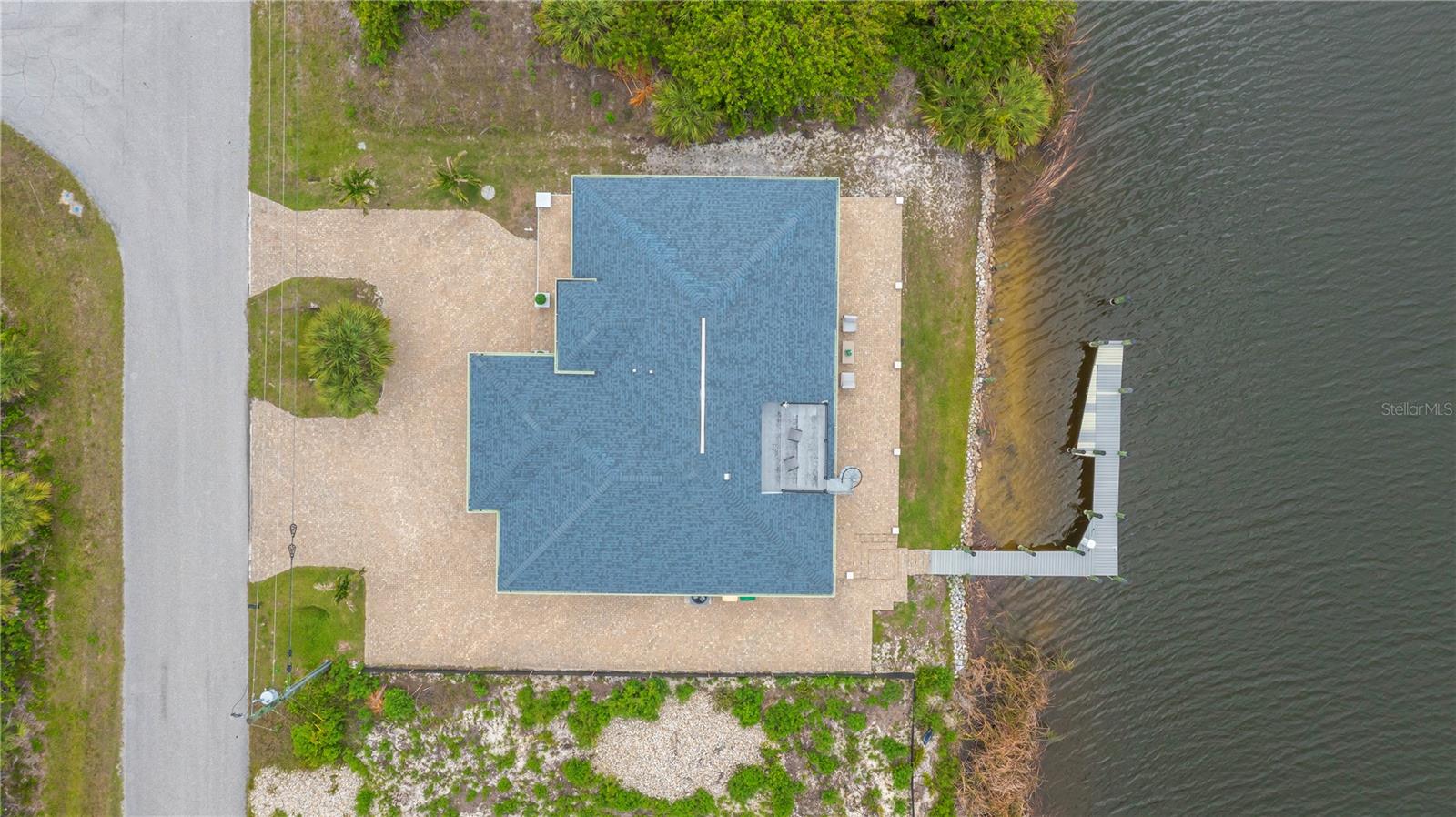 Circular Paver Driveway, Expansive Waterfront Patio, and Private Dock.