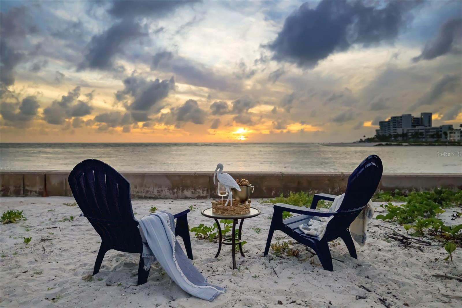 You can enjoy your sandy area beyond your pool or step just 3-doors down to the private deeded beach access for Lido Shores homeowners and relax right on the beach.