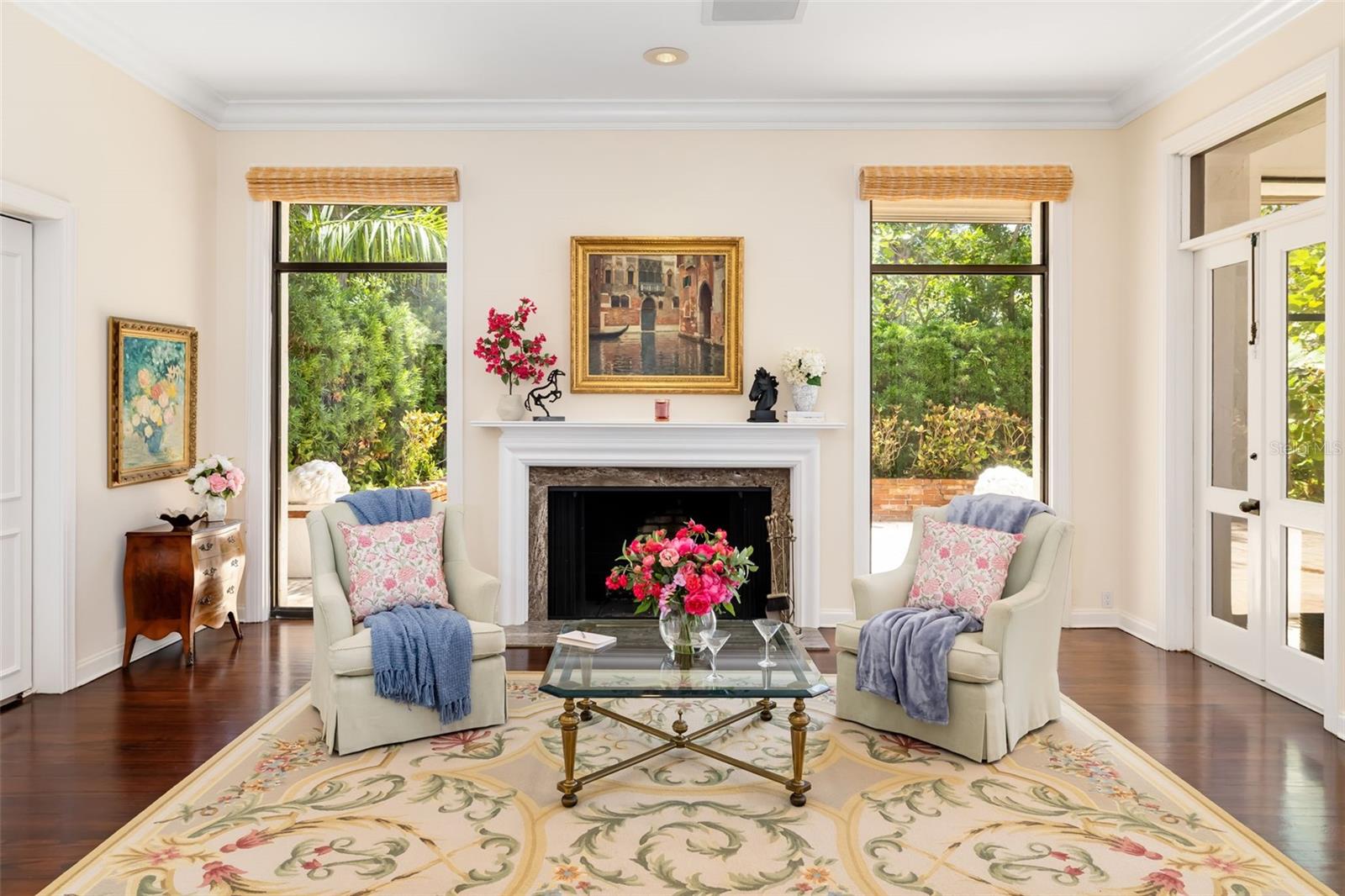 The wood burning fireplace and outside the windows you can see the lovely brick enclosed side patio that could be utilized for many creative purposes and the views are spectacular!