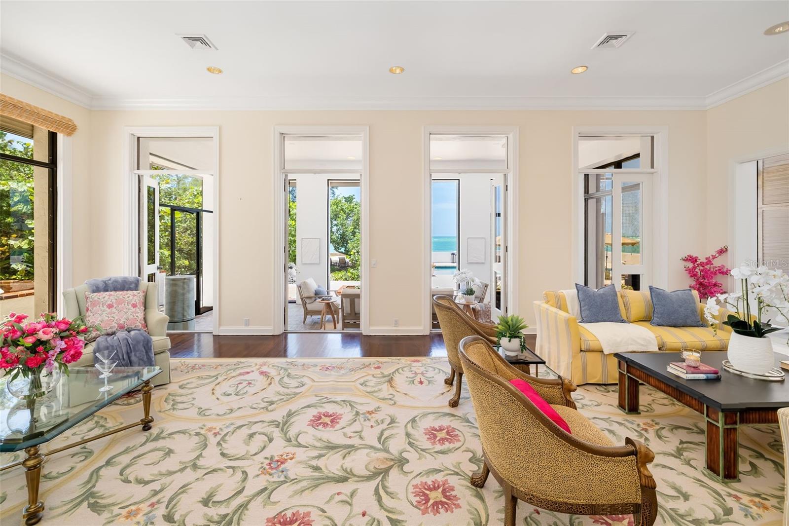 The formal living room is next to the library and the gathering room and flows nicely to and from.  The separation is an option and their are doors are most of the rooms in the home
