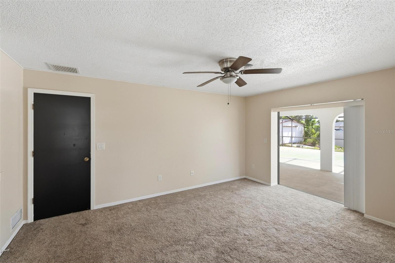 Primary Bedroom with pocket sliding glass door out to your lanai/pool.