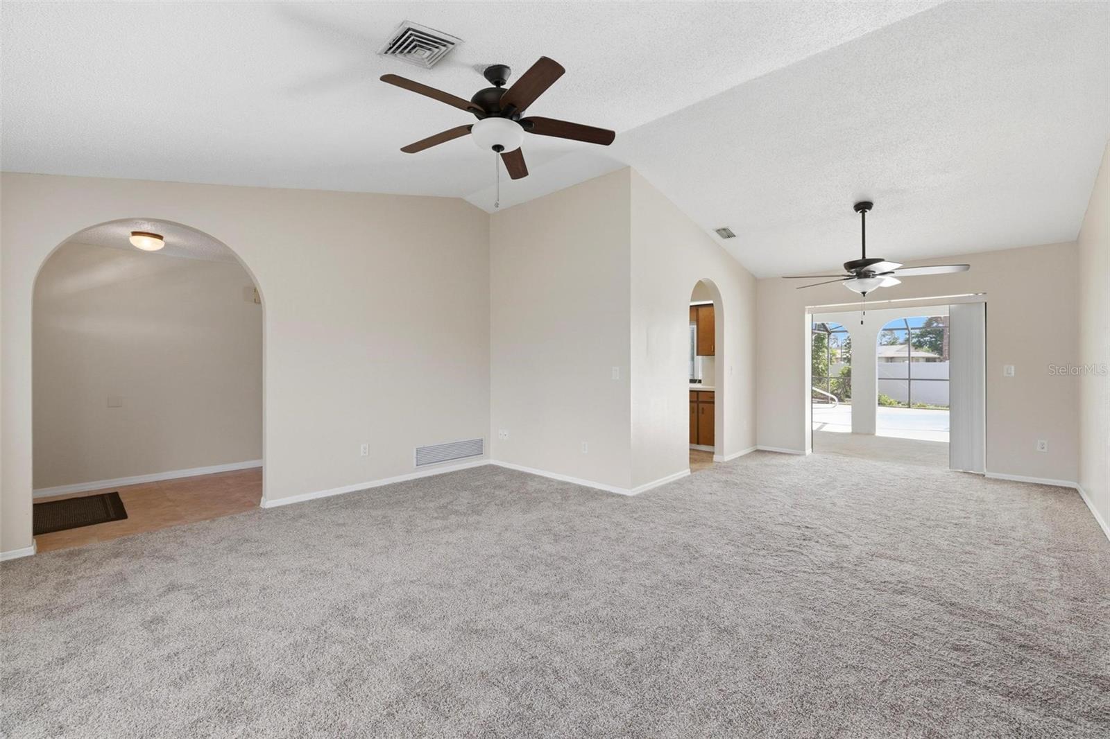 Living room to Dining room.... vaulted ceiling