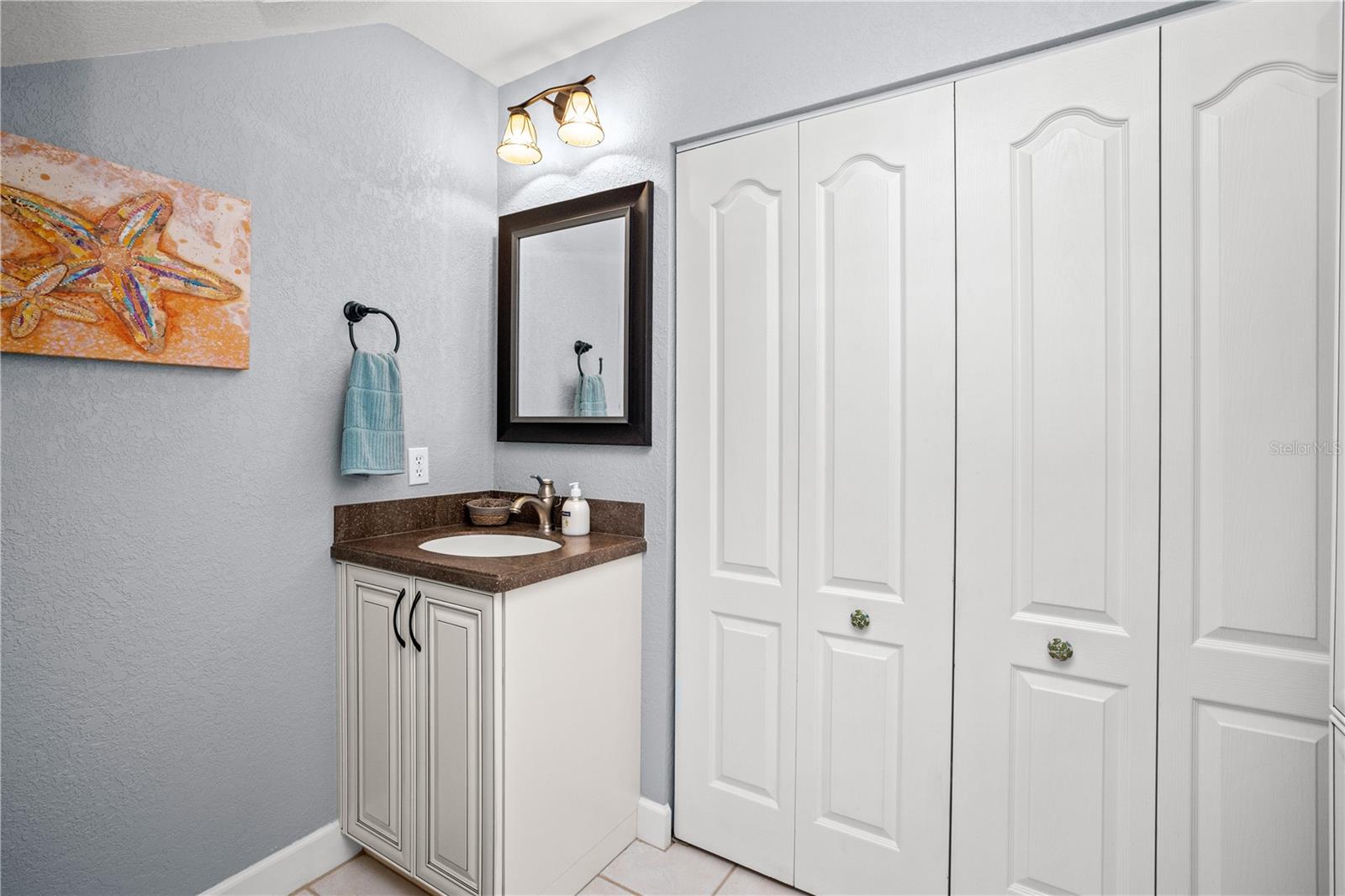 1st floor half bath with laundry in the closet