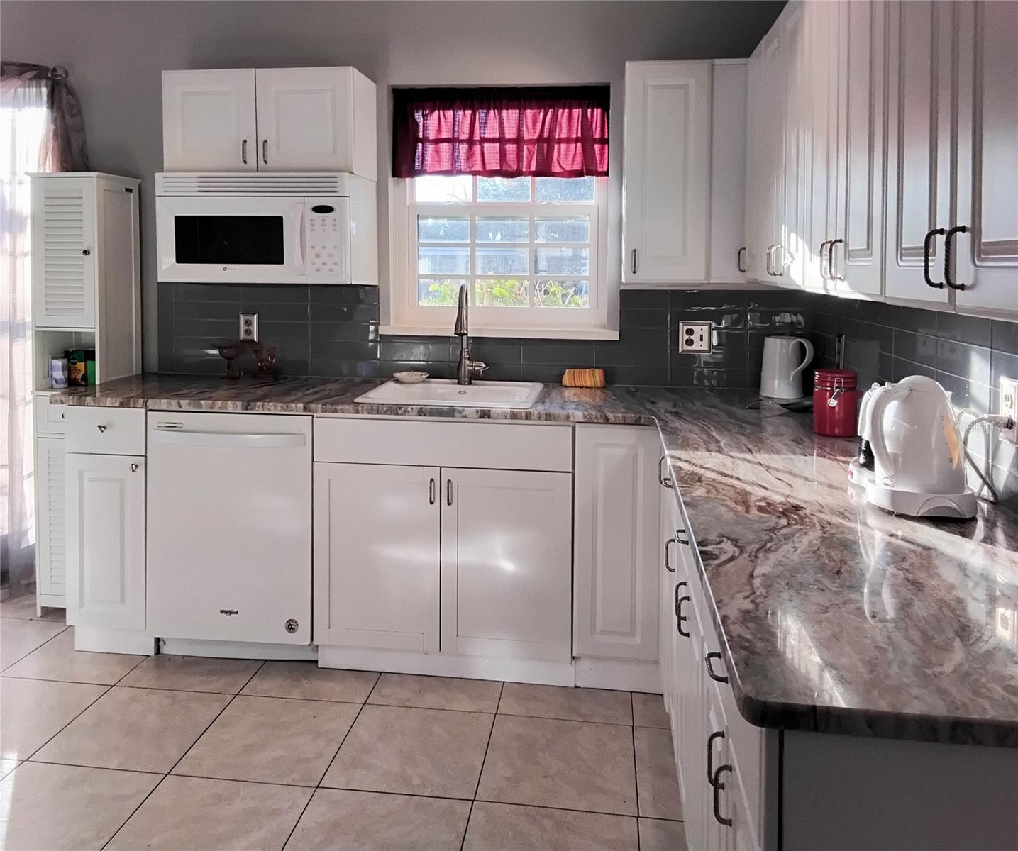 Kitchen looking to window in front of home