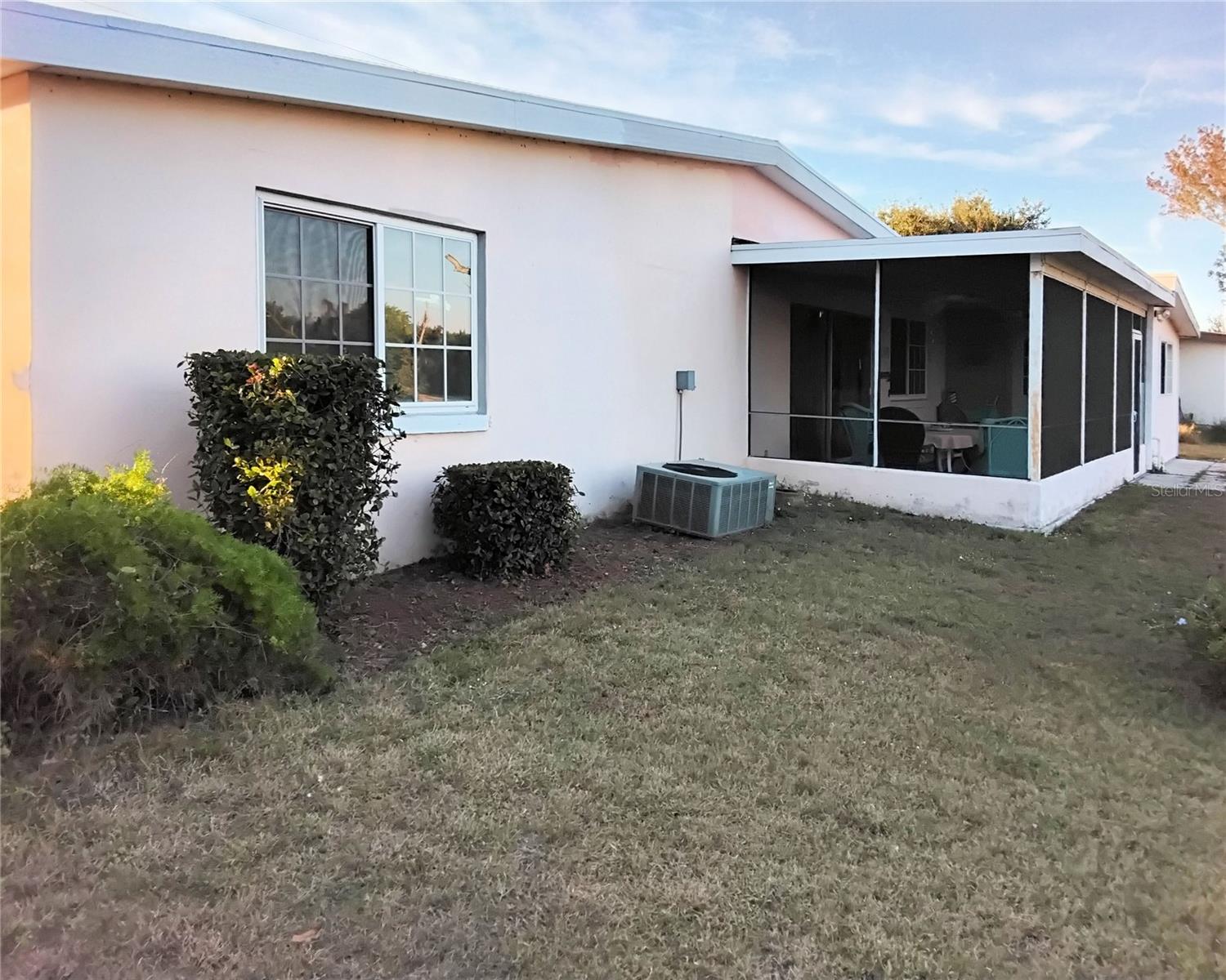 Back of house from left side of backyard