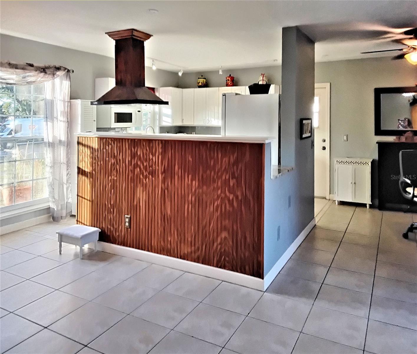 View of living area and kitchen from dining area