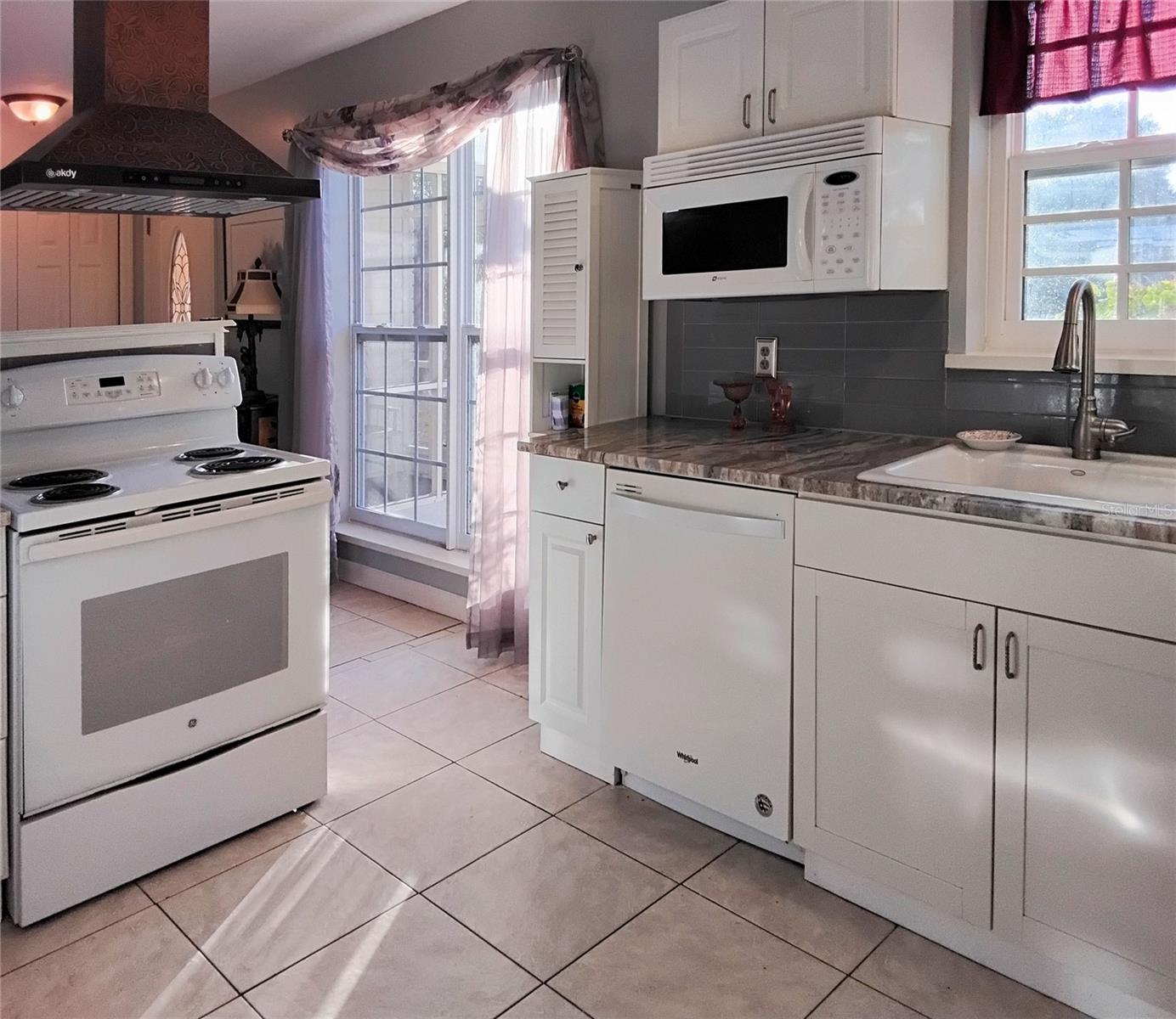 Kitchen with lots of natural light and granite countertops