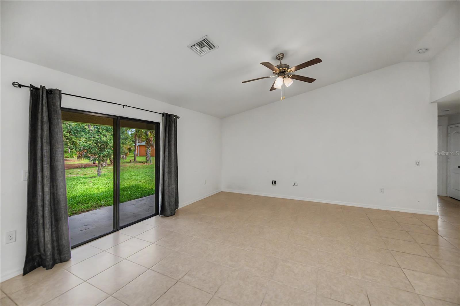 Bright Living Room with Direct Access to Patio