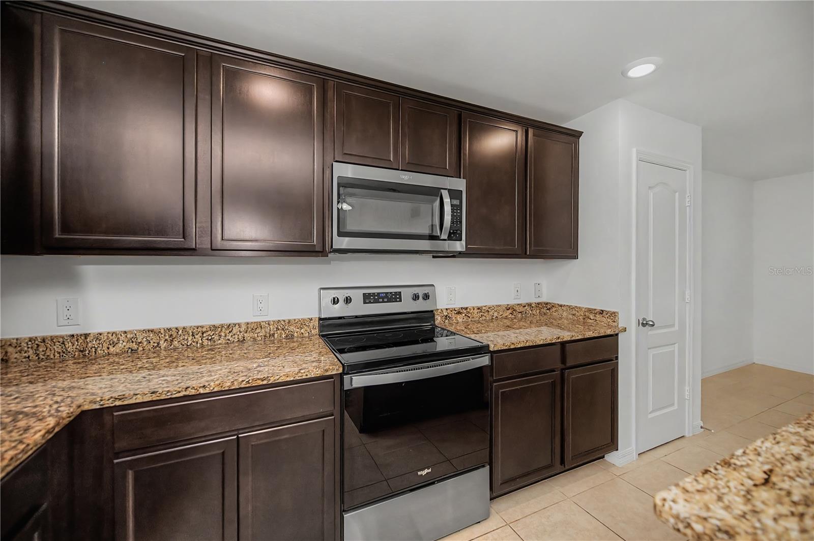 Granite Countertops and Ample Cabinet sPACE