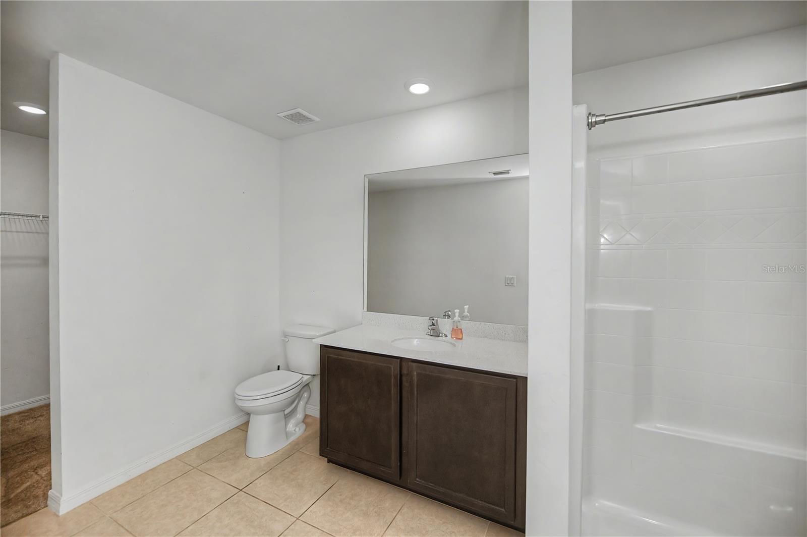Ensuite Bathroom with Oversized Vanity and Tub/Shower Combo