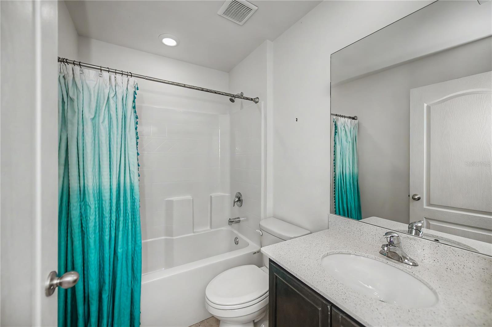 Guest Bathroom with Tub/Shower Combo and Vanity