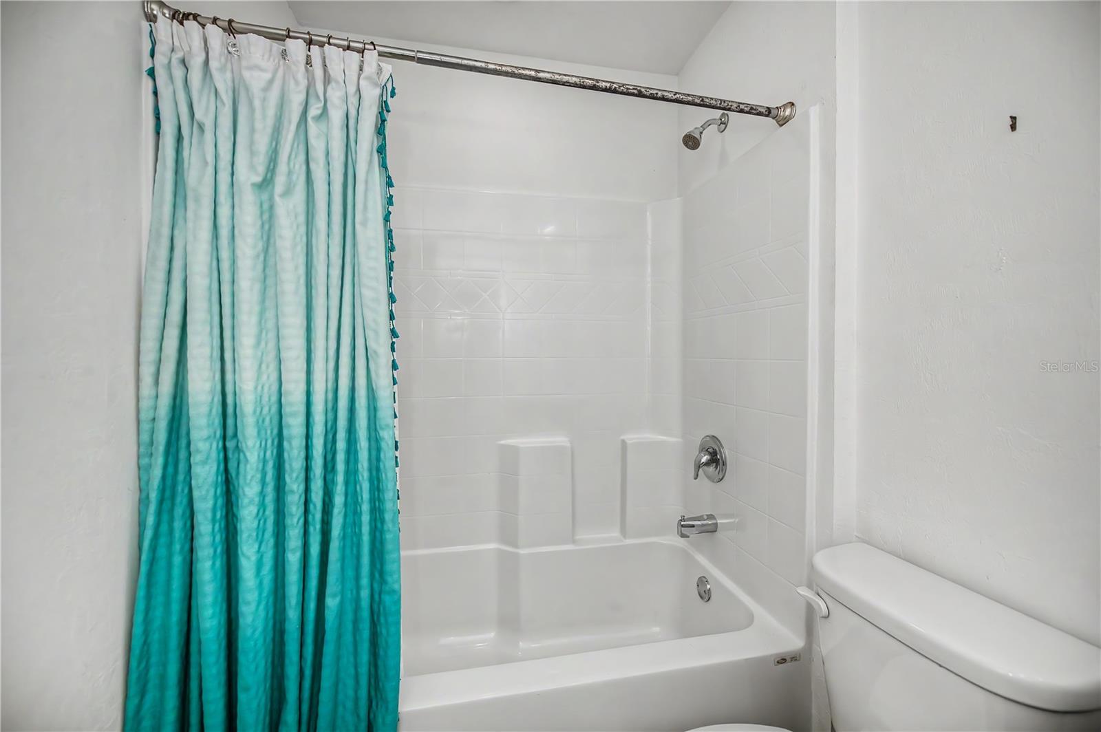 Guest Bathroom with Tub/Shower Combo and Vanity