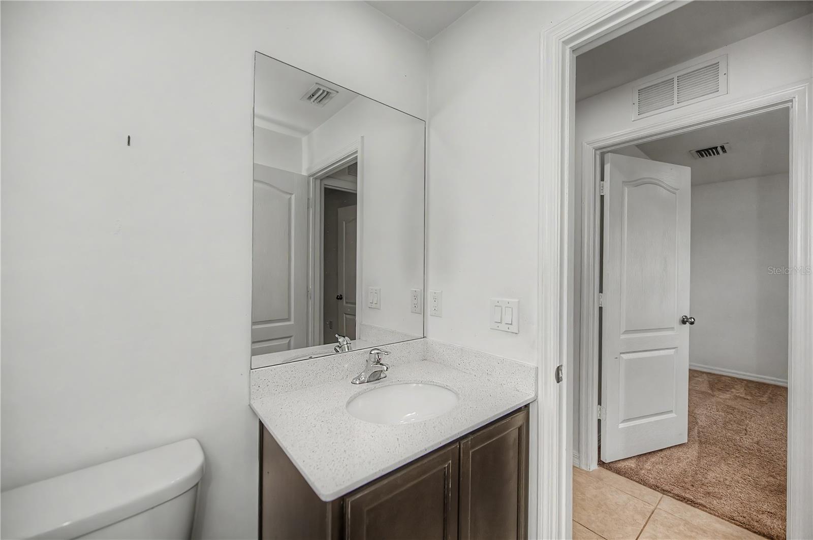 Guest Bathroom with Tub/Shower Combo and Vanity