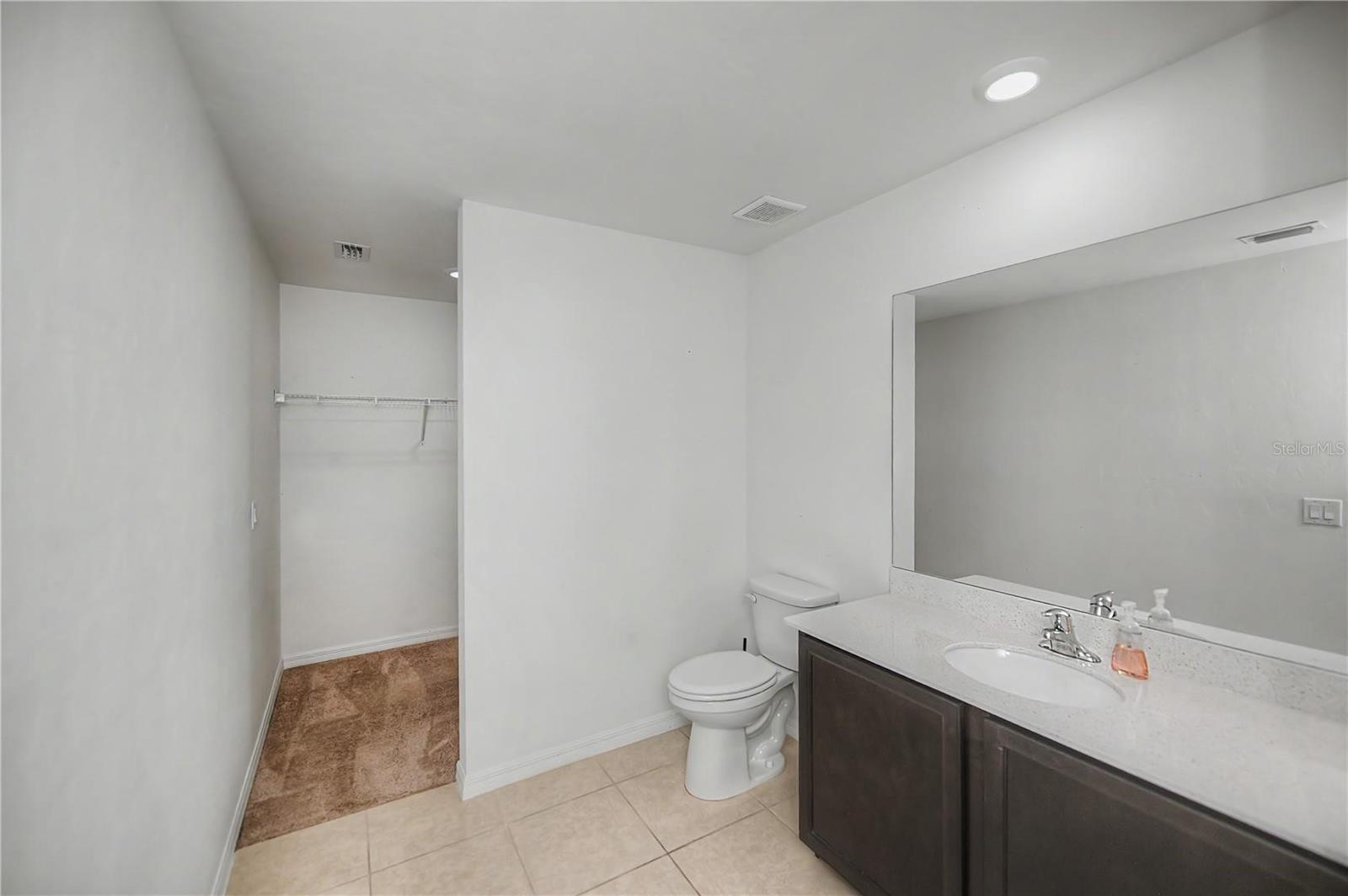 Ensuite Bathroom with Oversized Vanity and Tub/Shower Combo