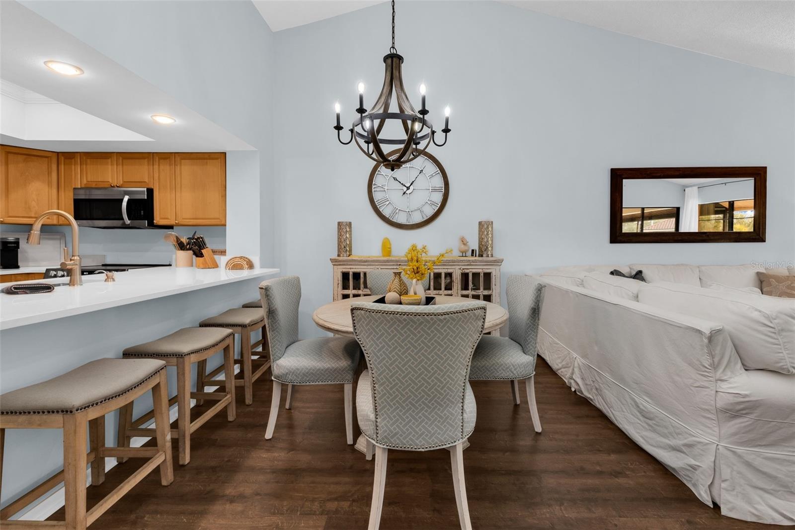 Kitchen features a breakfast bar which opens up to dining room