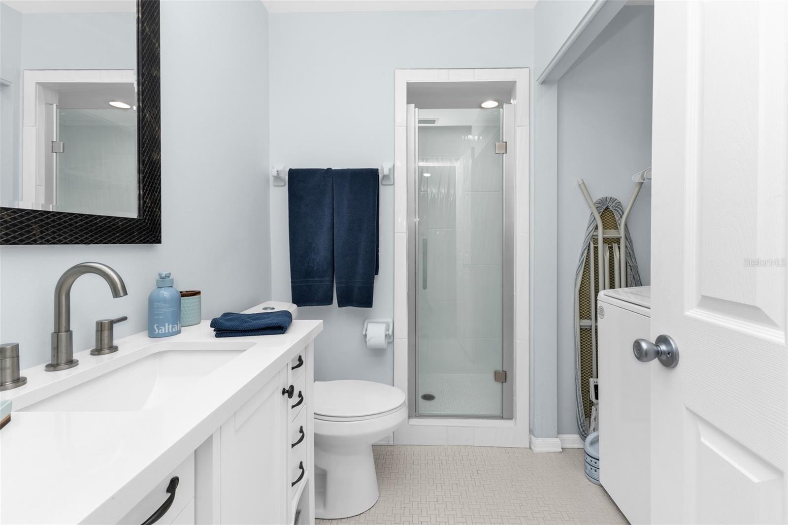 Walk-in shower with single vanity