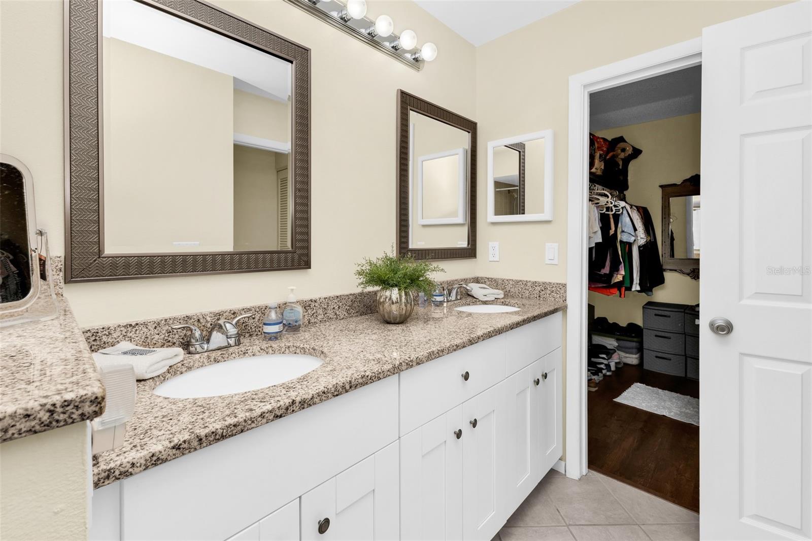 Primary bathroom has a walk in closet.