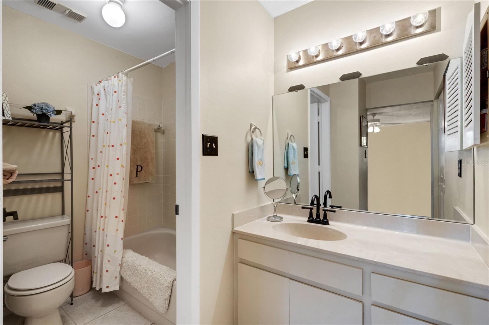 Primary vanity with shower/tub.