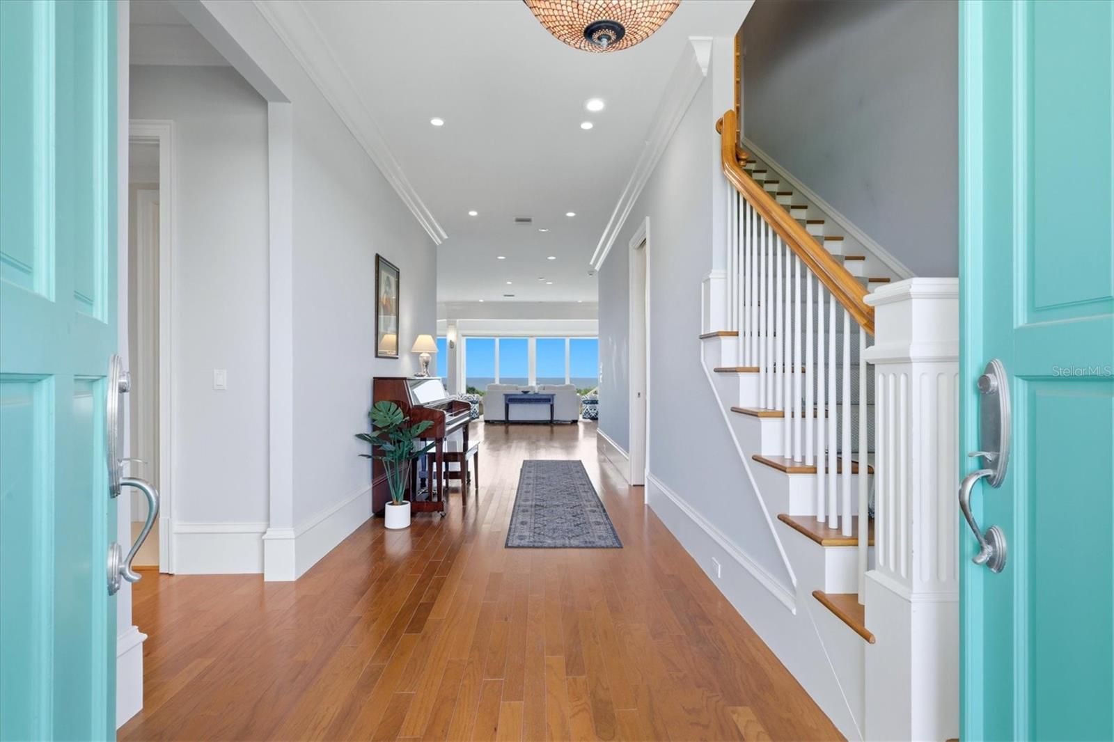 Grand entry with natural light and custom millwork