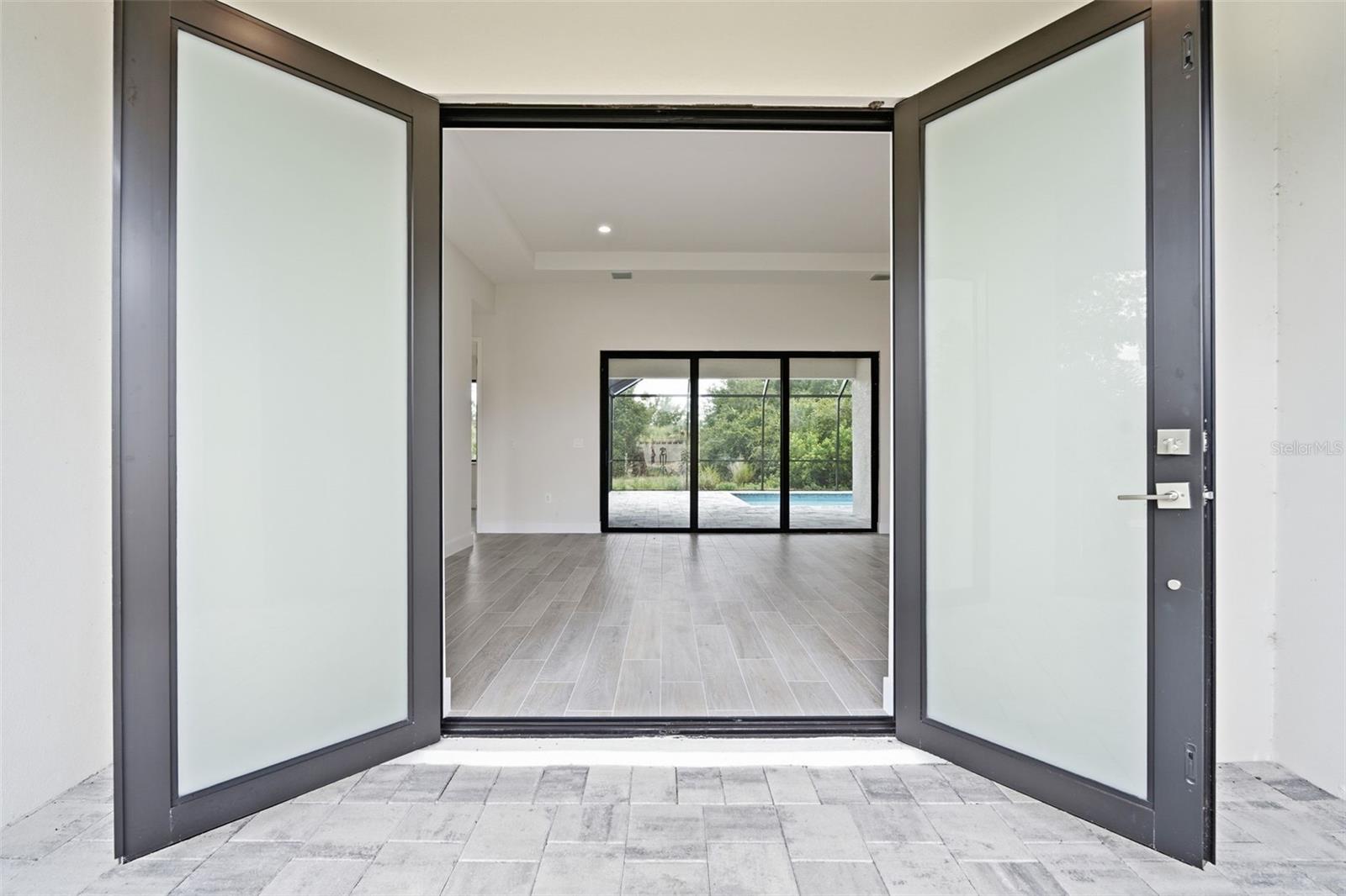 Double Frosted Entry Doors Welcome You Into the Home