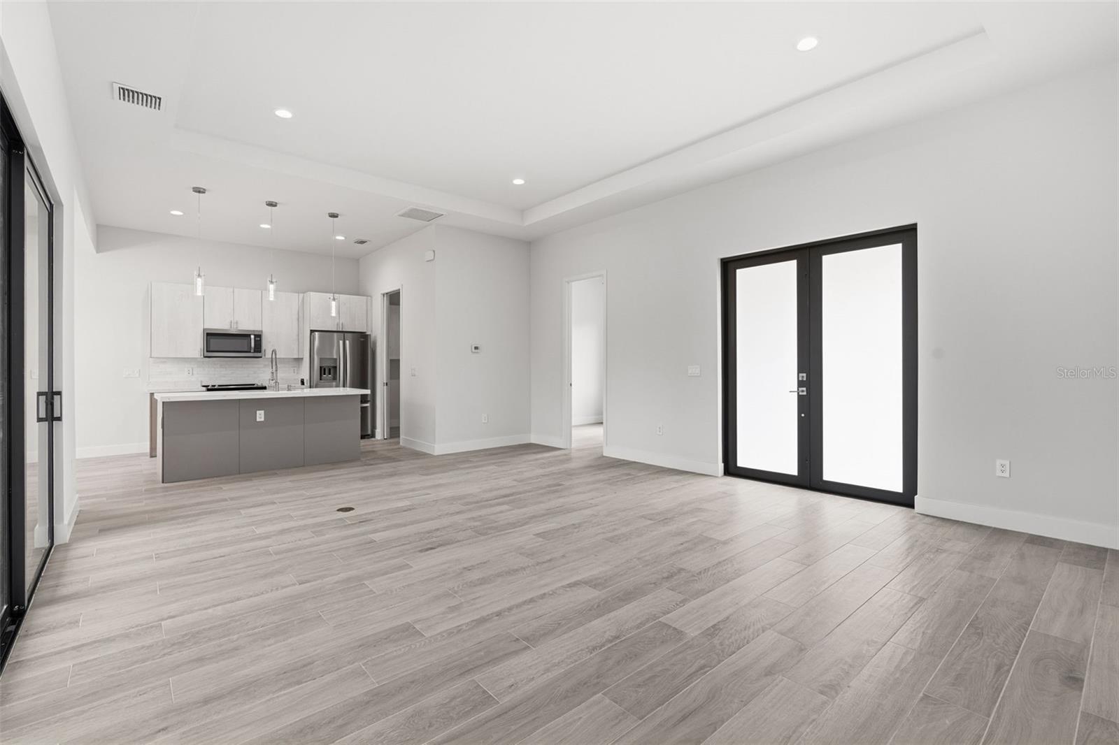 Spacious Living Area Showcasing 11ft Ceiling and Natural Light