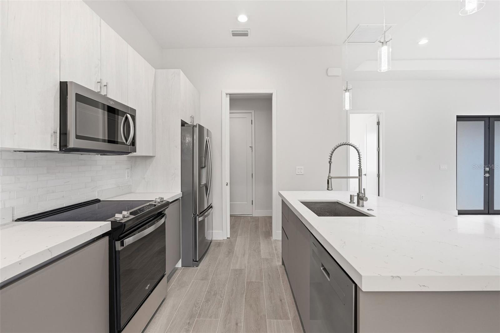 Modern Chefs Kitchen with Quartz Counters and Stainless Steel Appliances