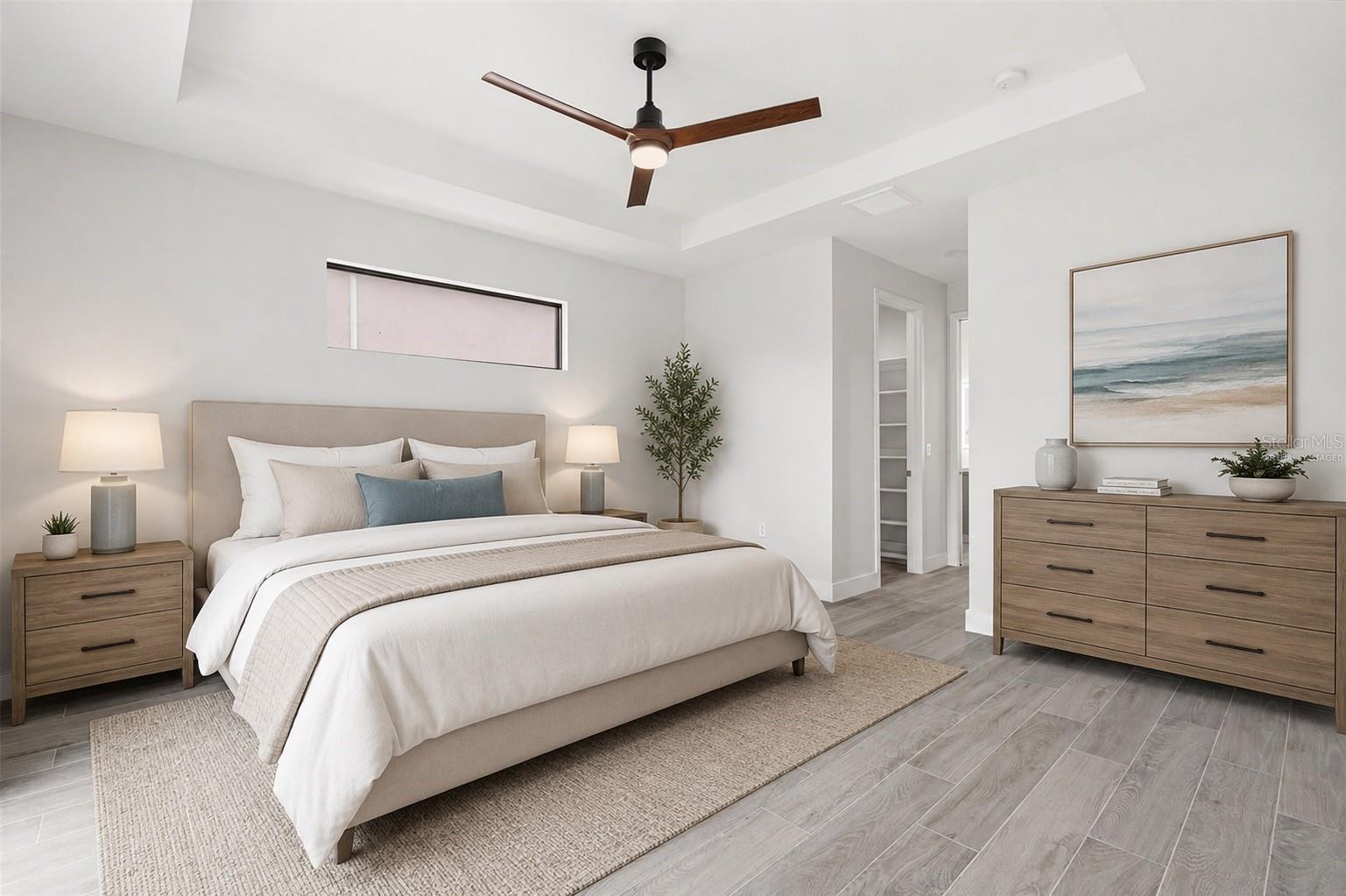 Virtually Staged Spacious Primary Bedroom with Tray Ceiling & Clerestory Window