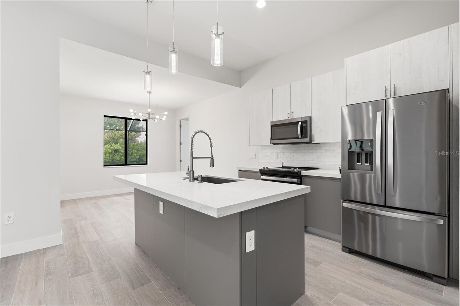 Kitchen Features Quartz Countertops and Stainless Steel Appliances
