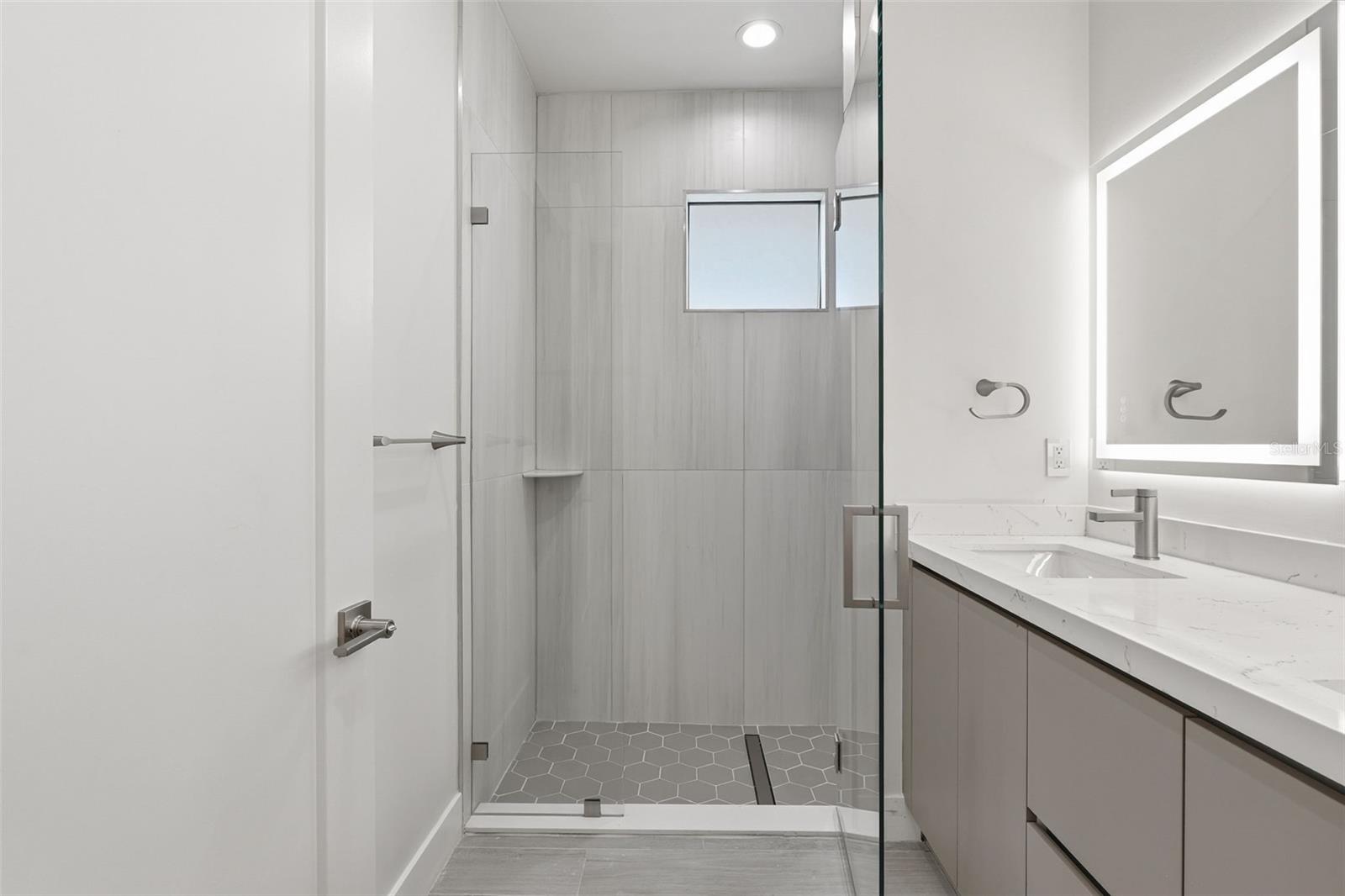Primary Bathroom with Dual Vanity, LED Mirrors and Walk-In Glass Shower