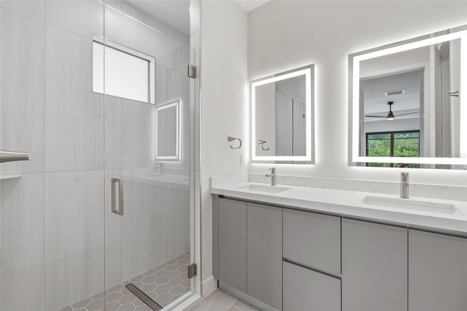 Primary Bathroom with Dual Vanity, LED Mirrors and Walk-In Glass Shower