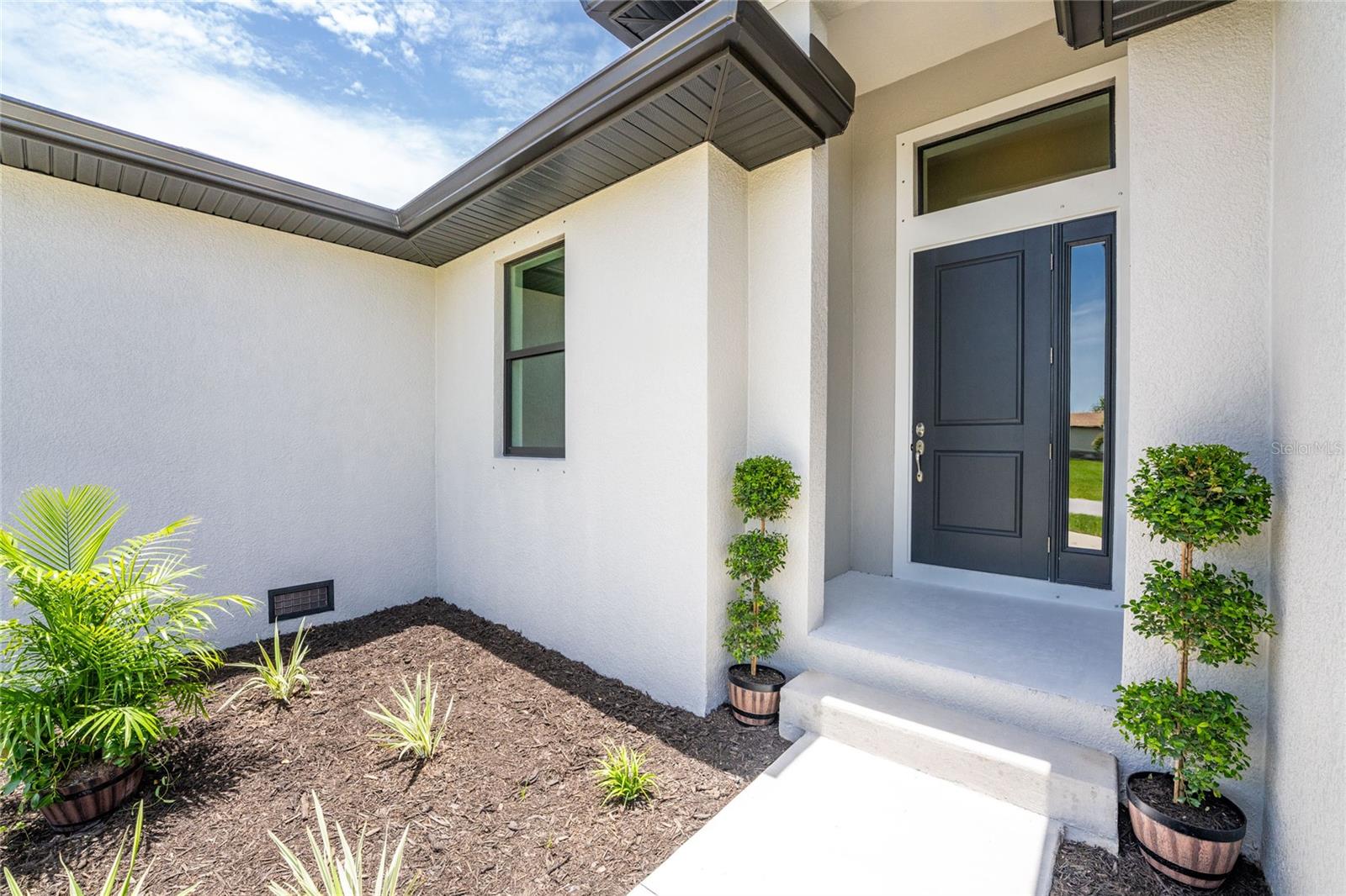 9590 Honeymoon Dr, Port Charlotte, FL 33981 — photo 3 of 50