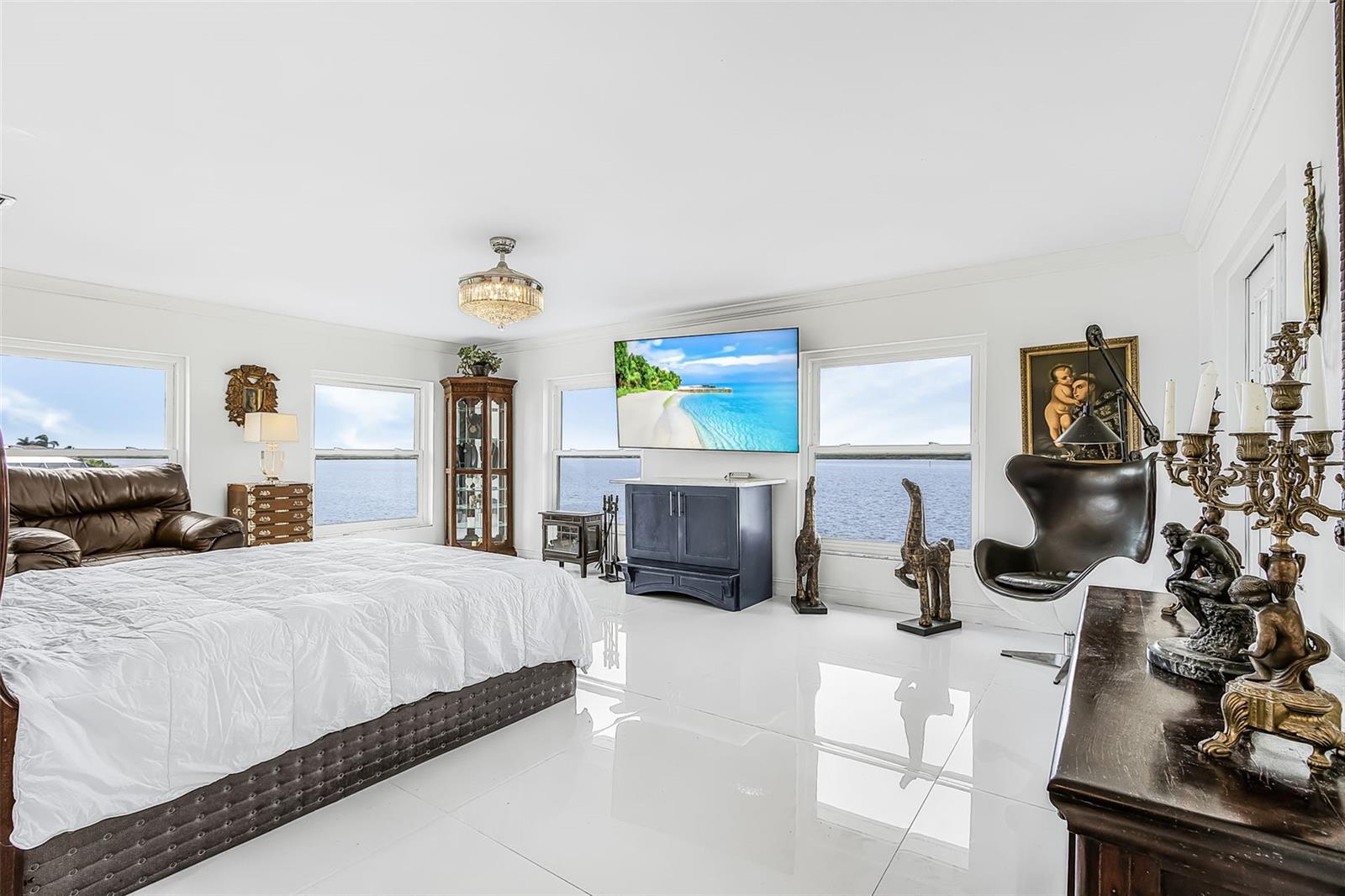 Second-floor primary bedroom overlooking the river