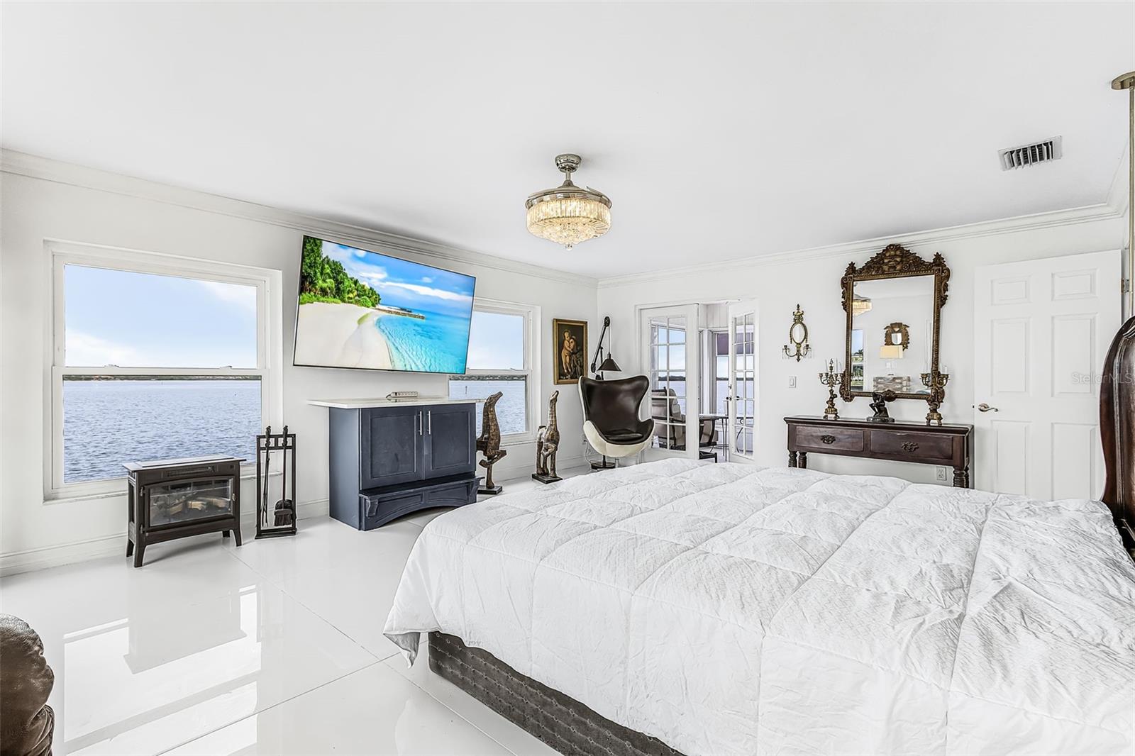 Second-floor primary bedroom overlooking the river