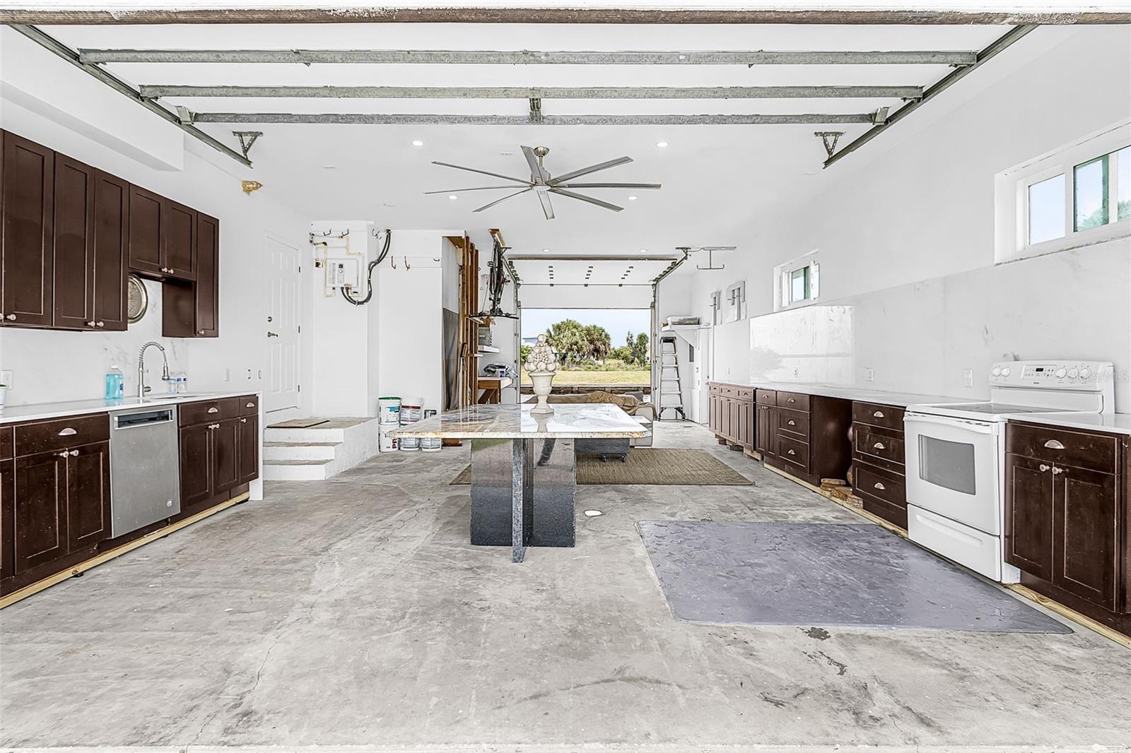 Garage with prep kitchen and canal-side exit