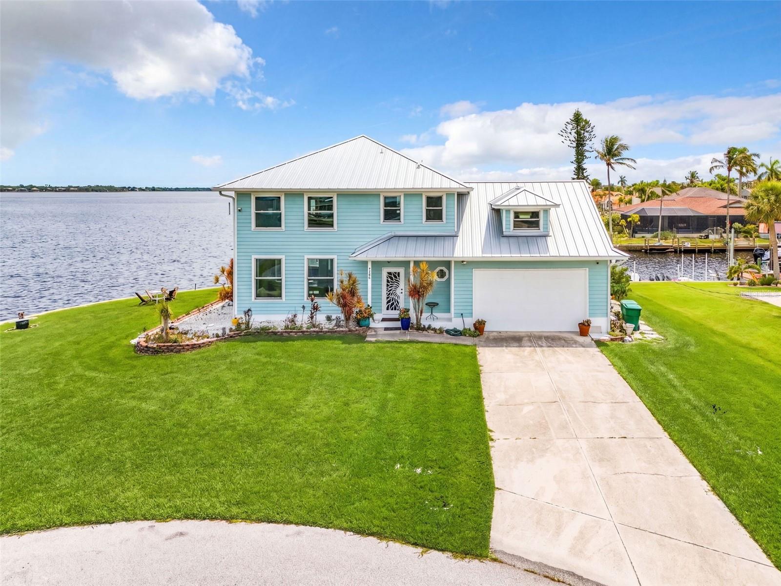 Front view of the home with full lot.