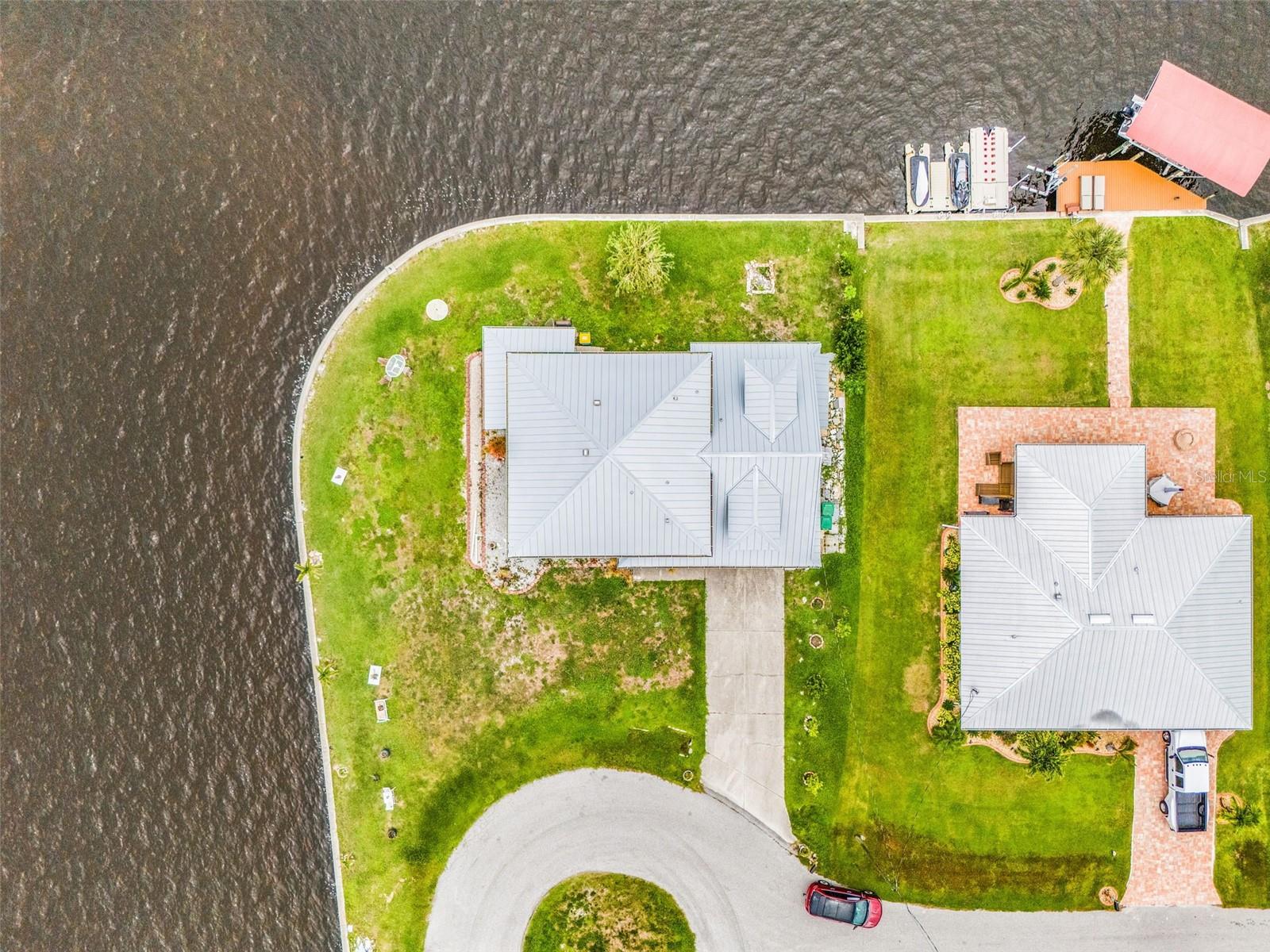 Front view of the home with full lot.