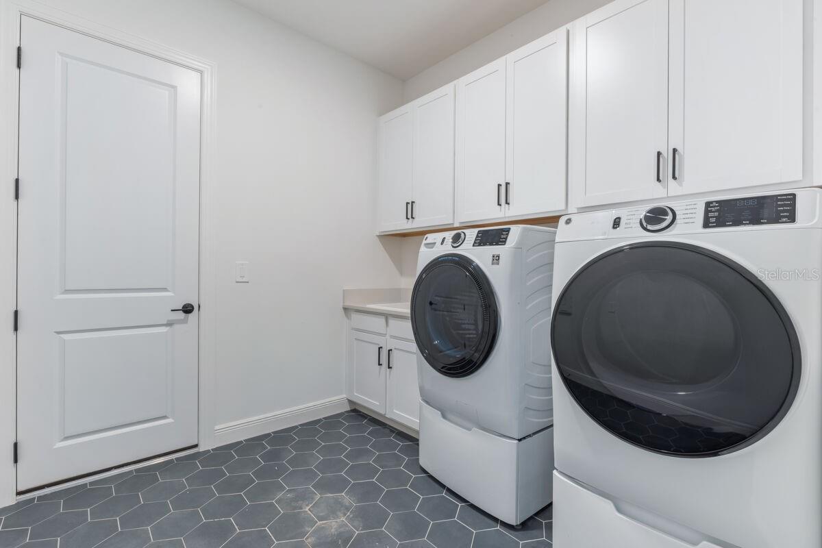 Laundry-Photo description represents the model home of same floor plan.