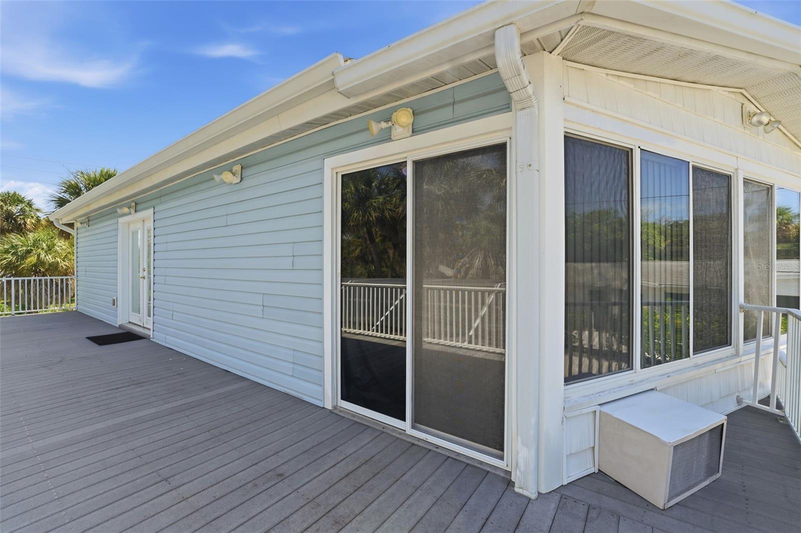OPEN DECK ACCESSED FROM CASUAL DINING ROOM & SUNPORCH