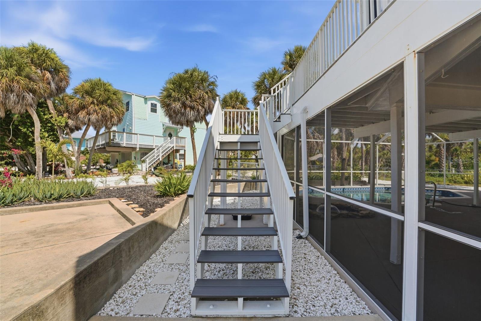 STAIRS FROM DECK TO YARD & EXTRA PARKING