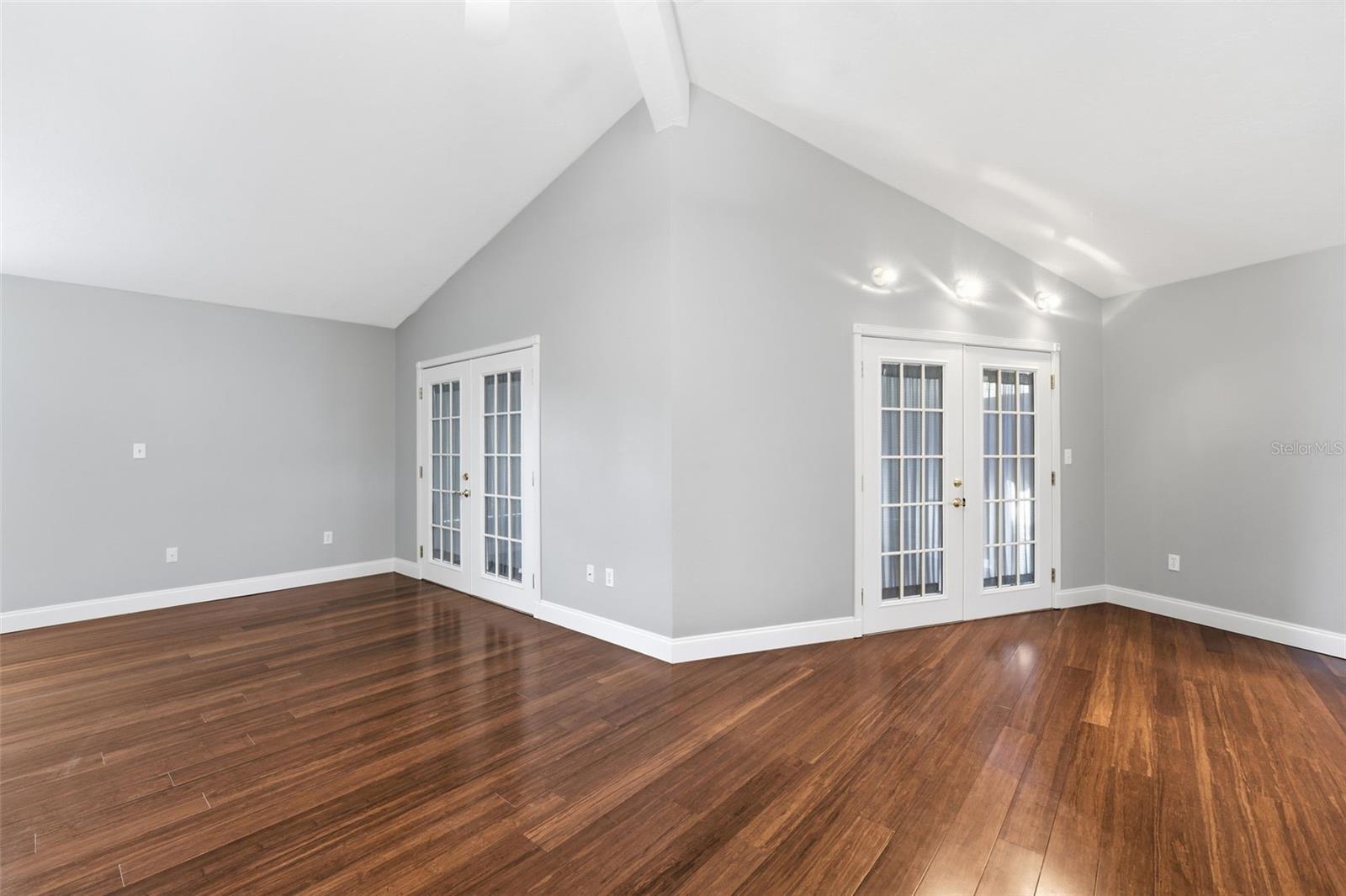 FORMAL LIVING & DINING ROOMS WITH FRENCH DOORS TO SUNPORCH